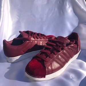 Adidas burgundy with a velvet to detail!